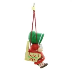 Christmas Is For Children Hallmark Ornament Girl Sitting In Swing -Toy Store Girl with bonnet in swing christmas ornament